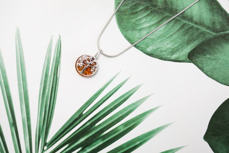 Silver pendant with amber