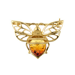Silver brooch with amber
