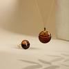 Silver pendant with amber