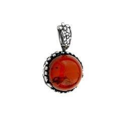 Silver pendant with amber