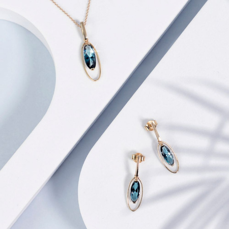 Gold earrings with london blue topaz