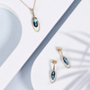 Gold pendant with london blue topaz