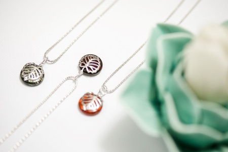 Silver pendant with amber